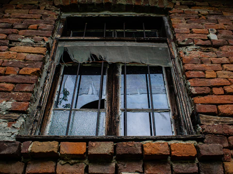 Window opening in an old brick building where gaps can open between the frame and the masonry