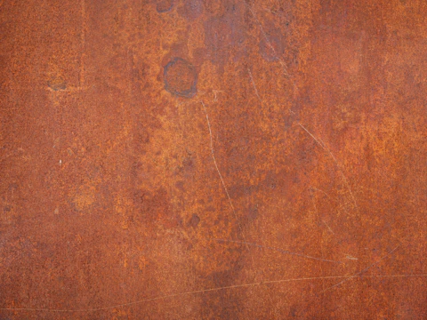 Weathered surface with patches of orange rust staining