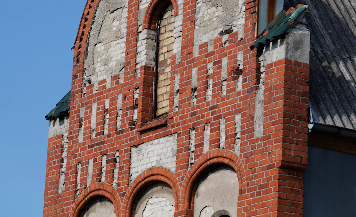 Ornate gable at the top of an old brick building