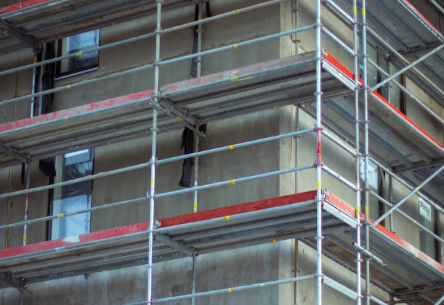 Residential building wrapped in scaffolding for exterior work